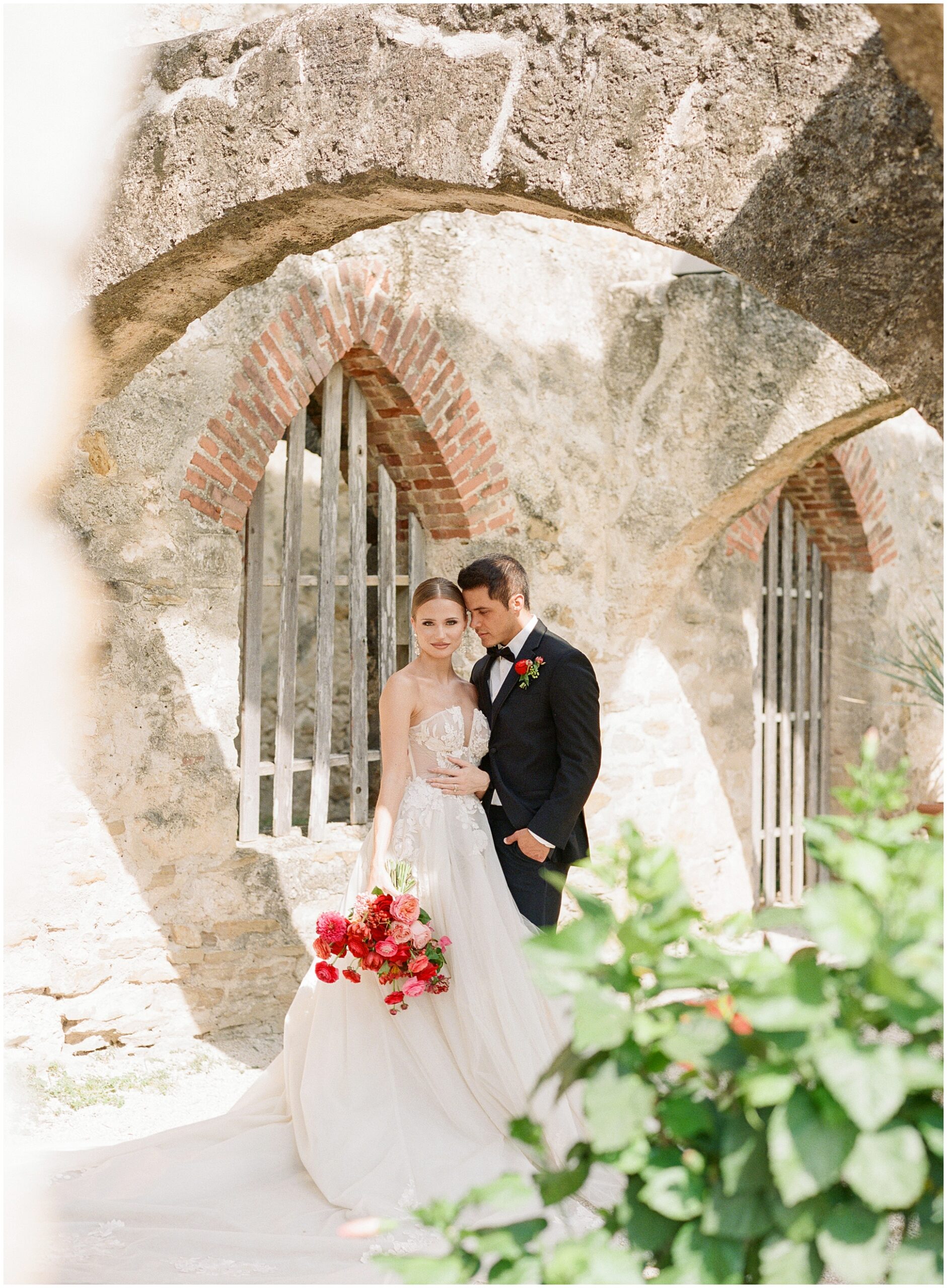 A timeless film photograph of couple at San Antonio San Jose Mission