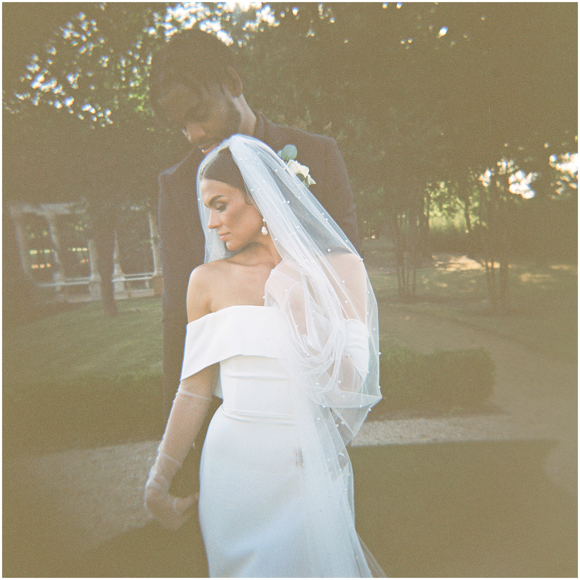 Abbi and Juwan standing in front of the elegant Knotting Hill venue, looking radiant and in love.