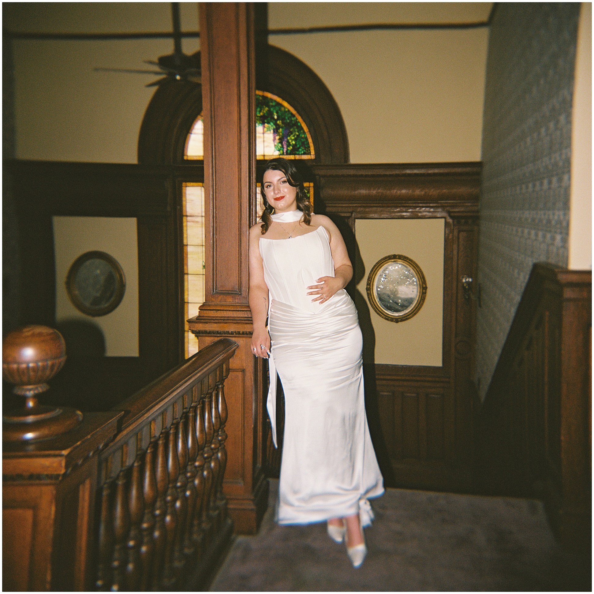 bride at top of staircase at Alexander House 