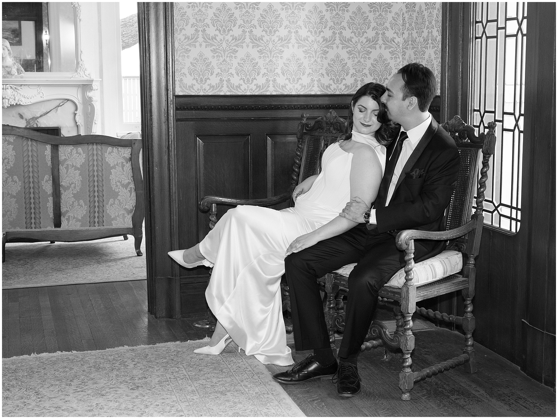 Bride and groom in a carved chair Alexander Mansion engagement session