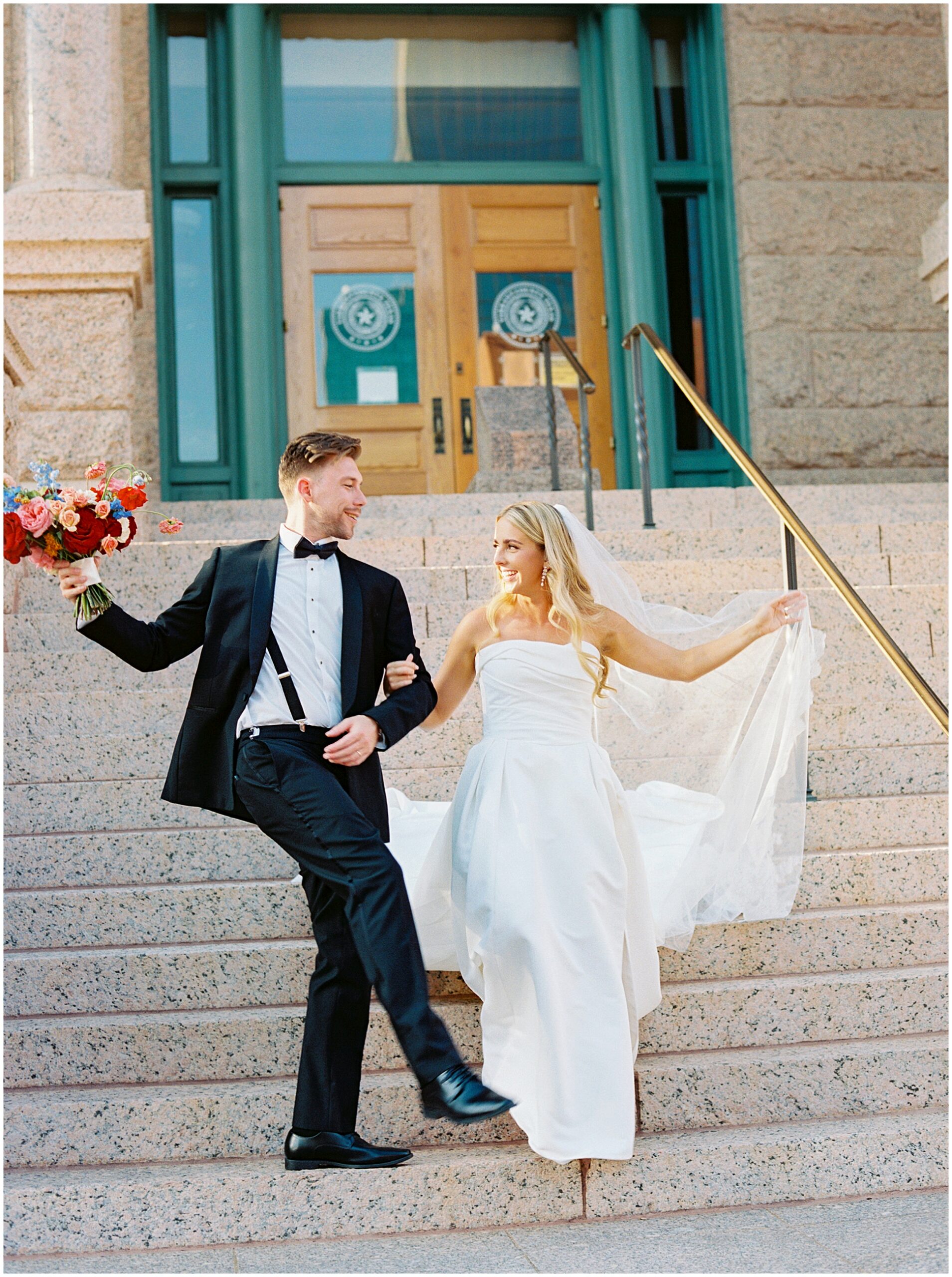 bride and groom portraits at the fort worth courthouse steps