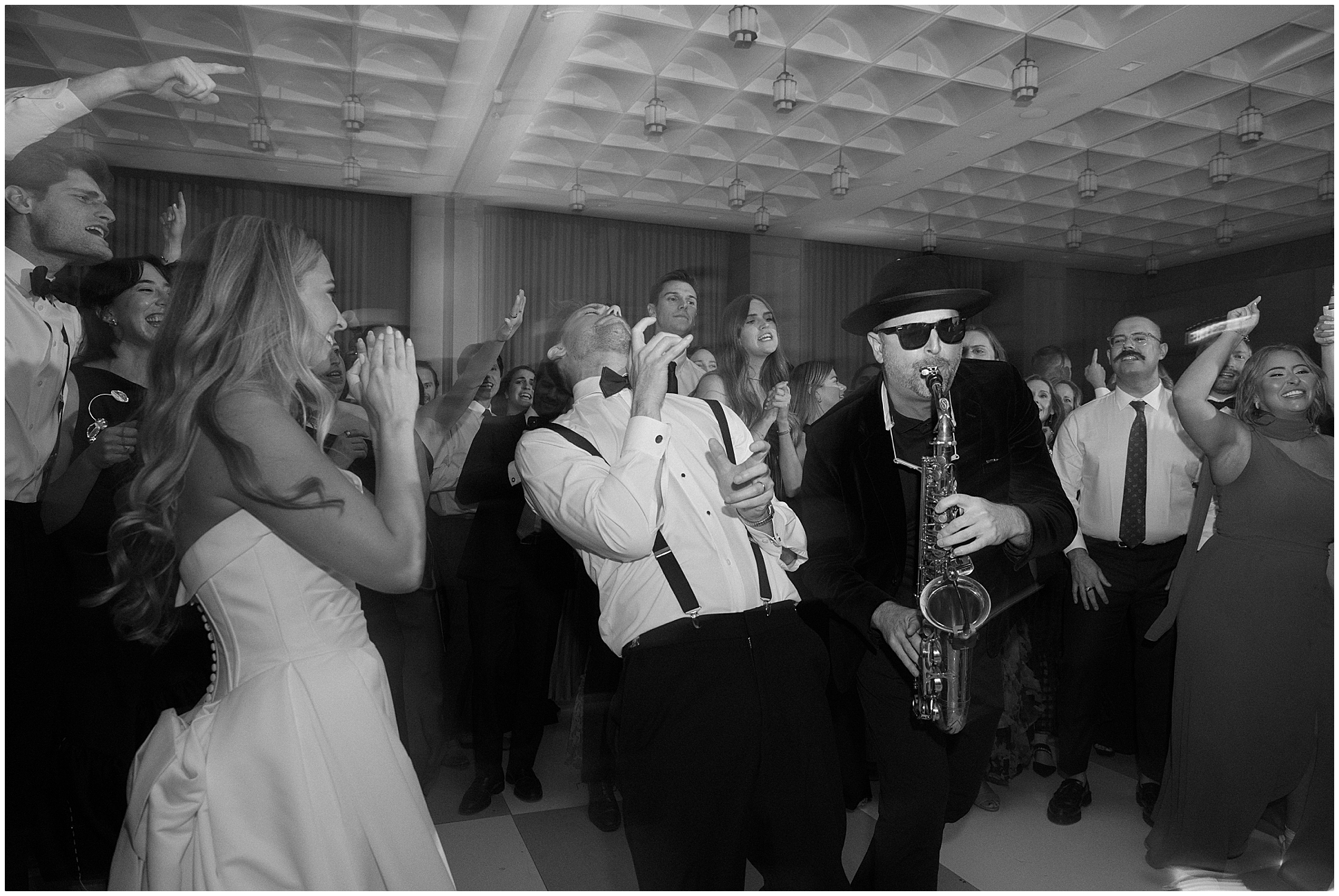 bride and groom and saxophone player on dance floor at hotel crescent fort worth
