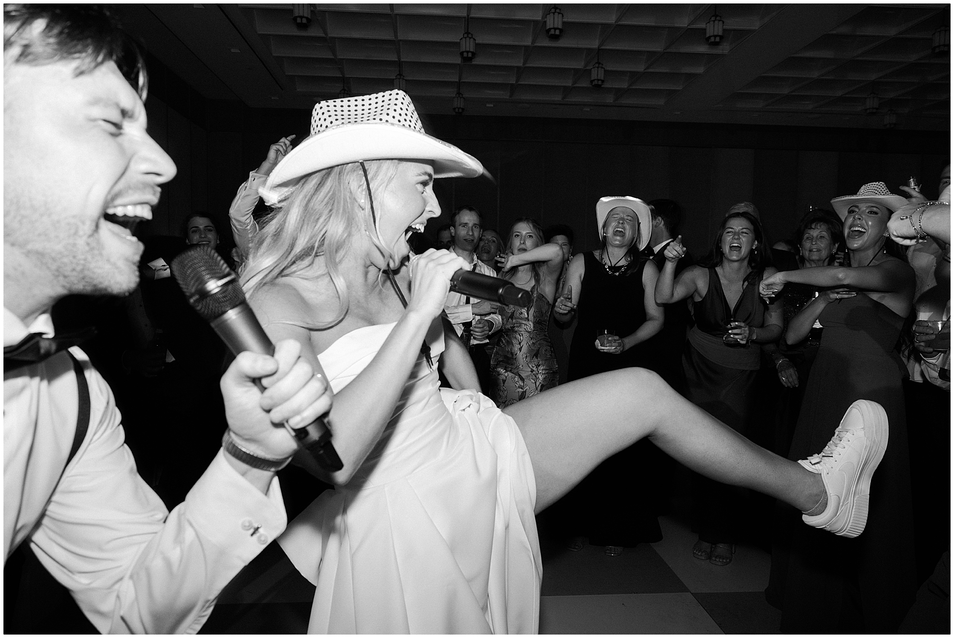 bride and groom karaoke on dance floor at hotel crescent fort worth