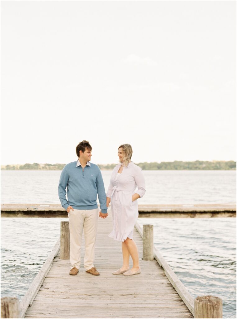 couple standing on dock at white rock lake 