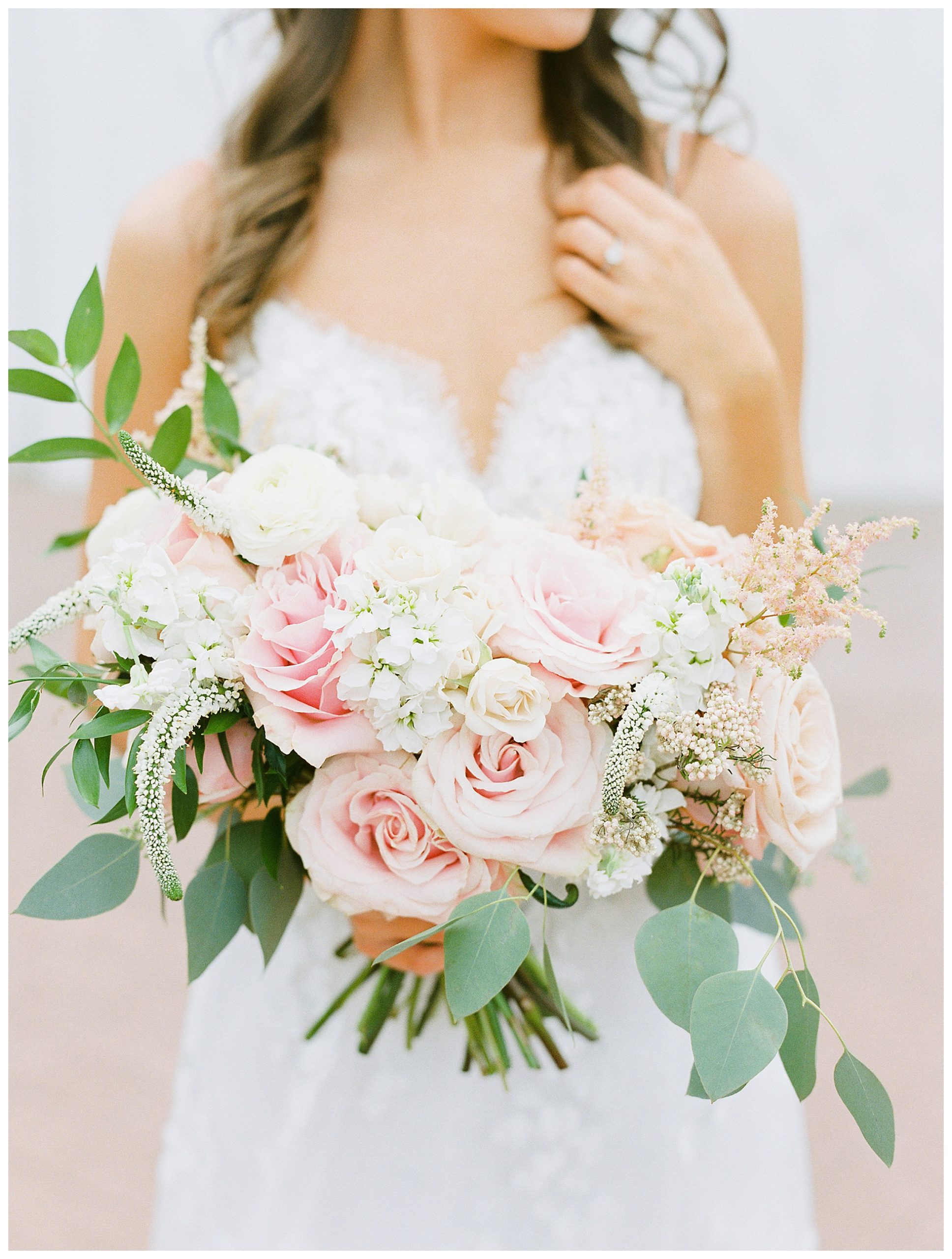 Bride holding wedding bouquet at White Sparrow barn