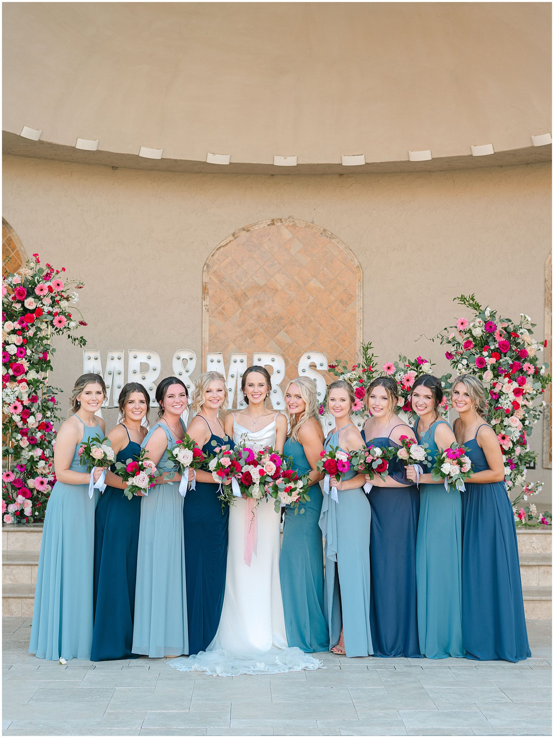 Bride and Bridesmaids in Shades of Blue sleek gowns.