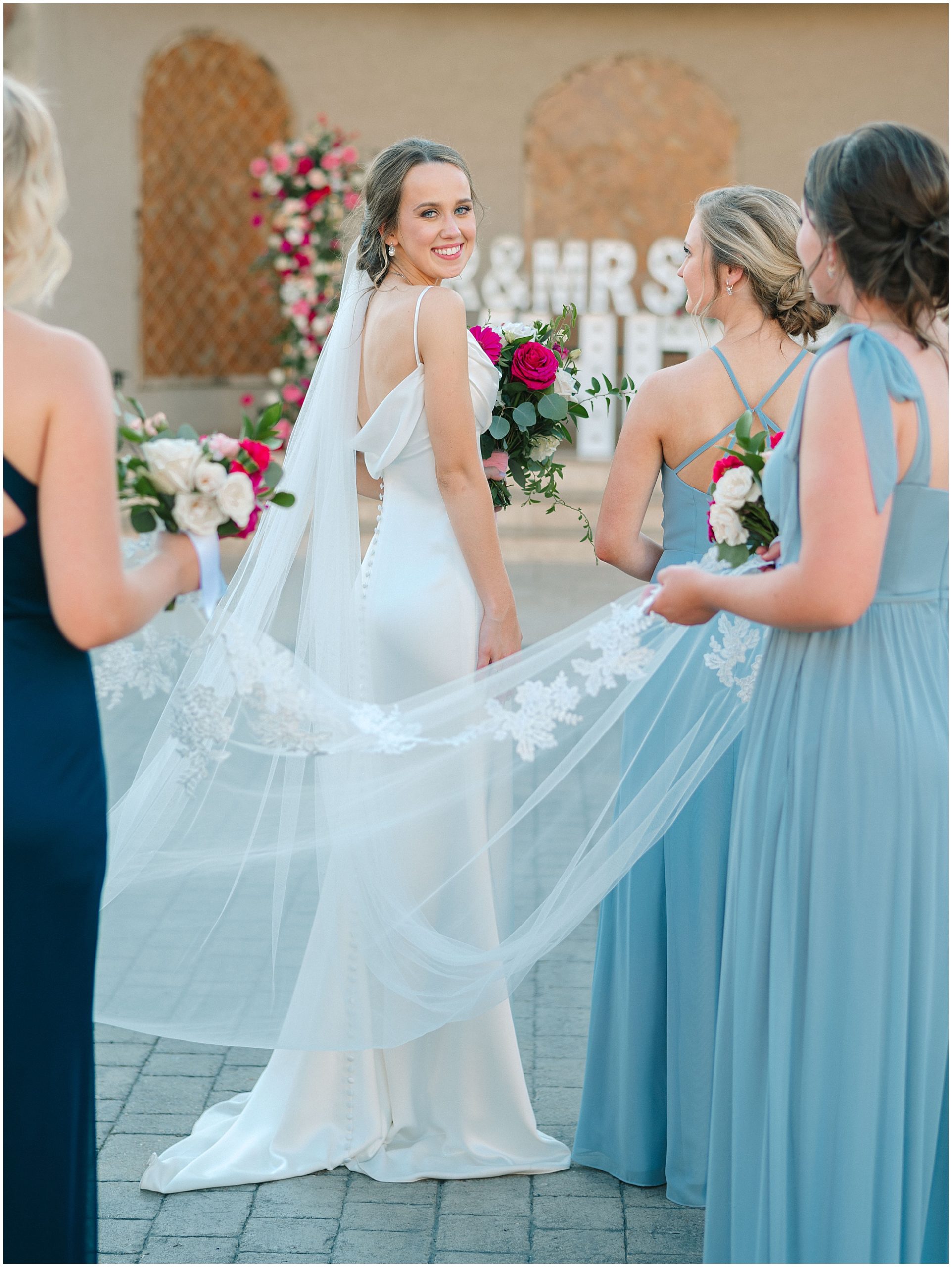 Bride with sleek wedding gown at Dvine Grace Vineyard