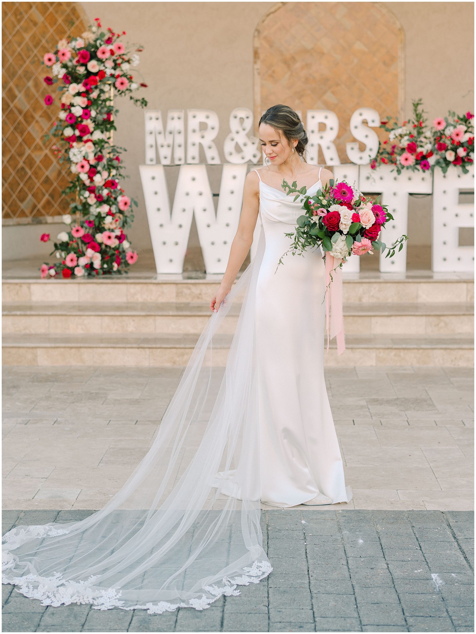 Modern Bride with colorful flowers and sleek gown at Dvine Grace 