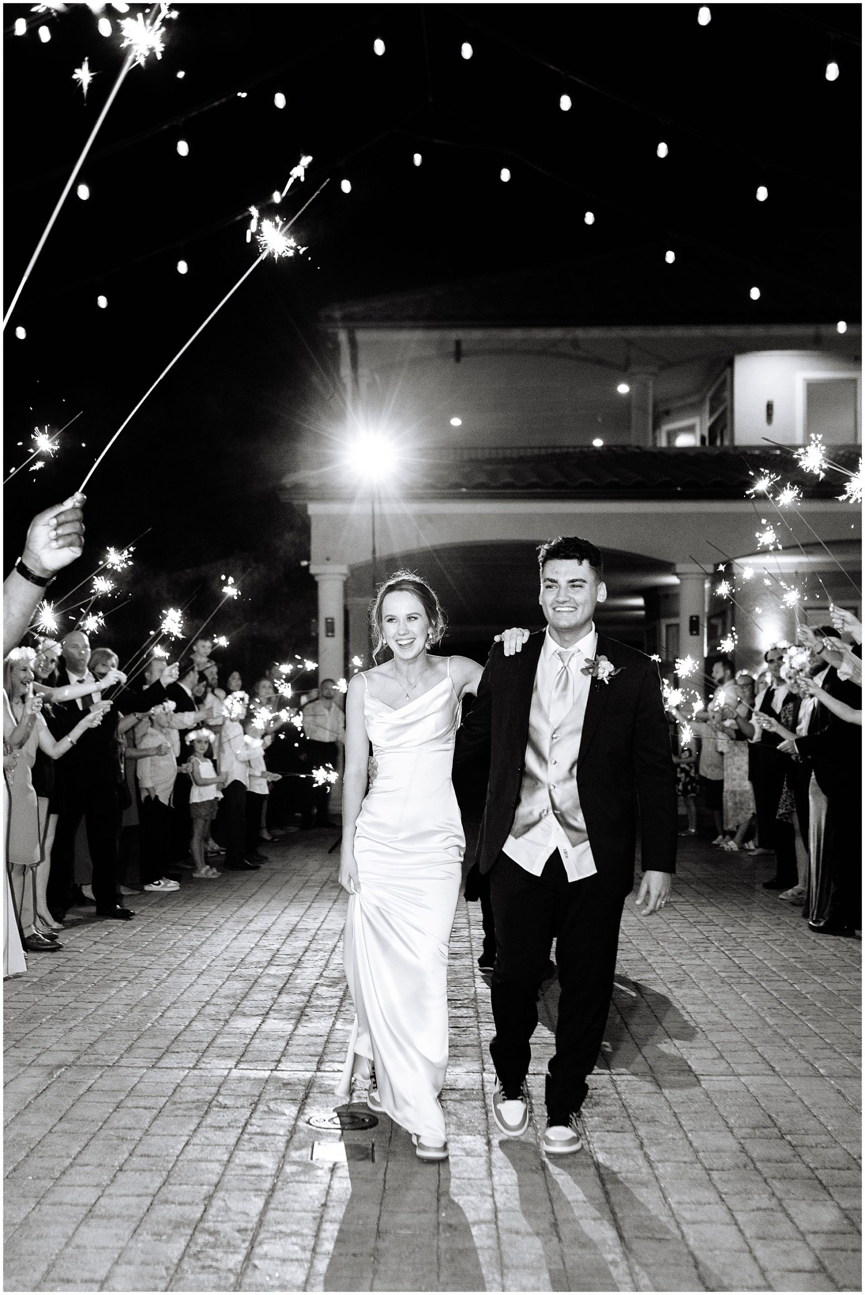 Bride and Groom leaving their wedding, black and white Photography