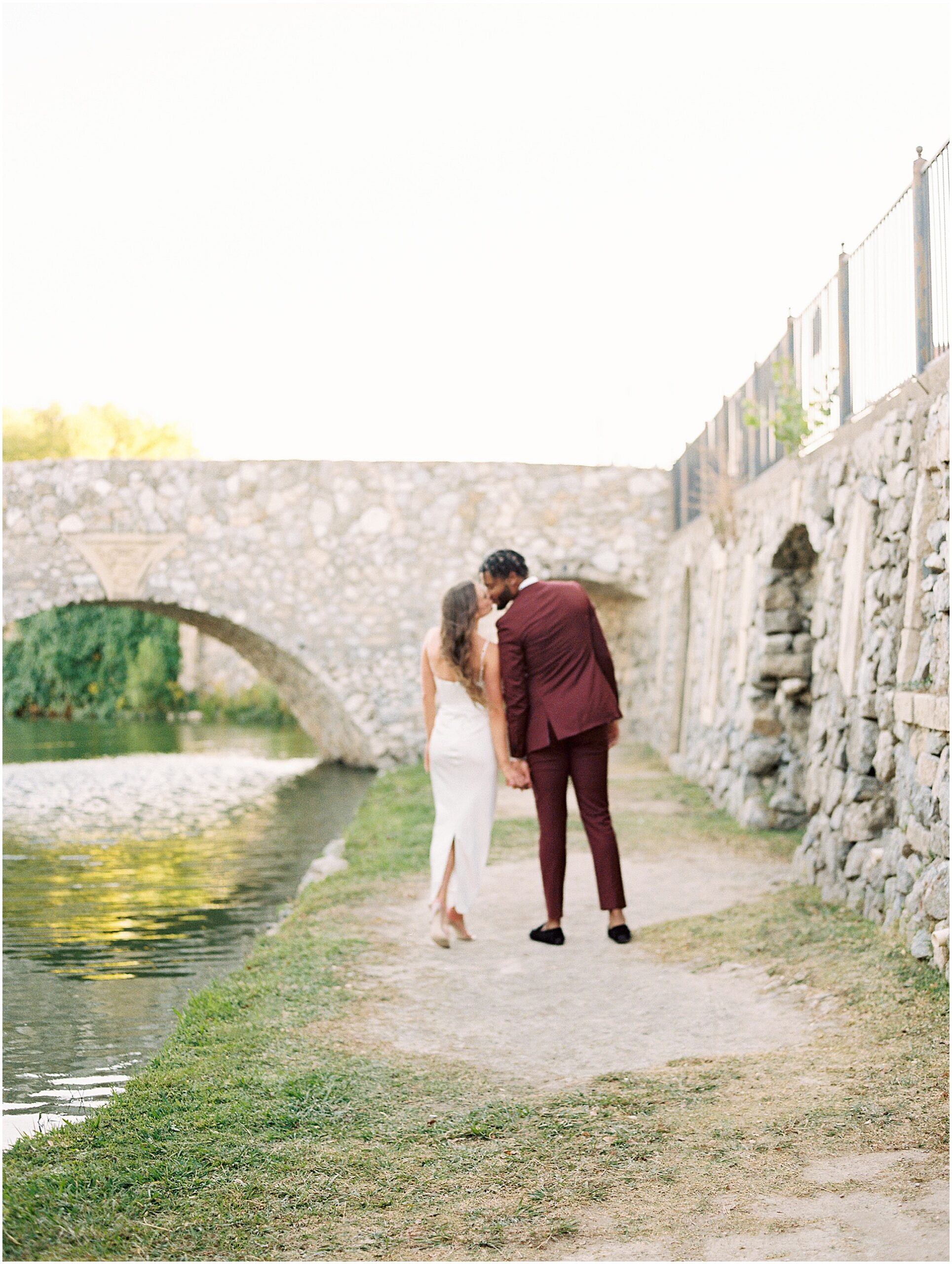 Stylish and Chic couple kissing at adriatica village.