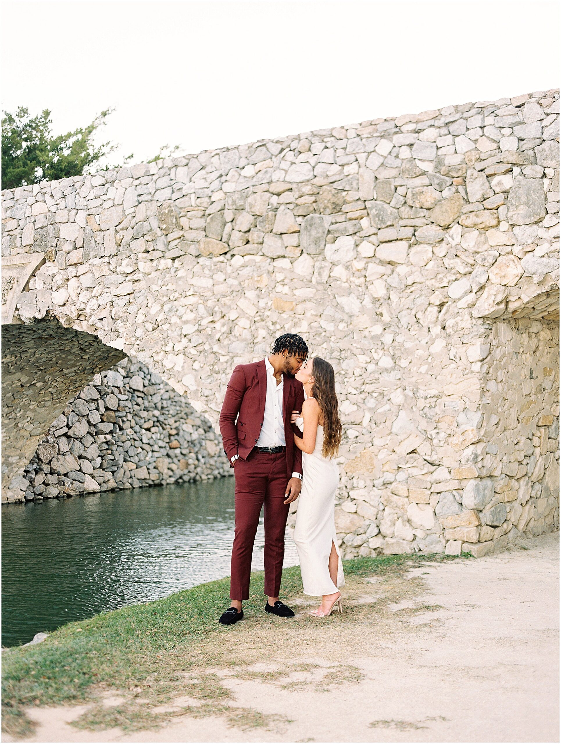 Stylish and Chic couple kissing at adriatica village