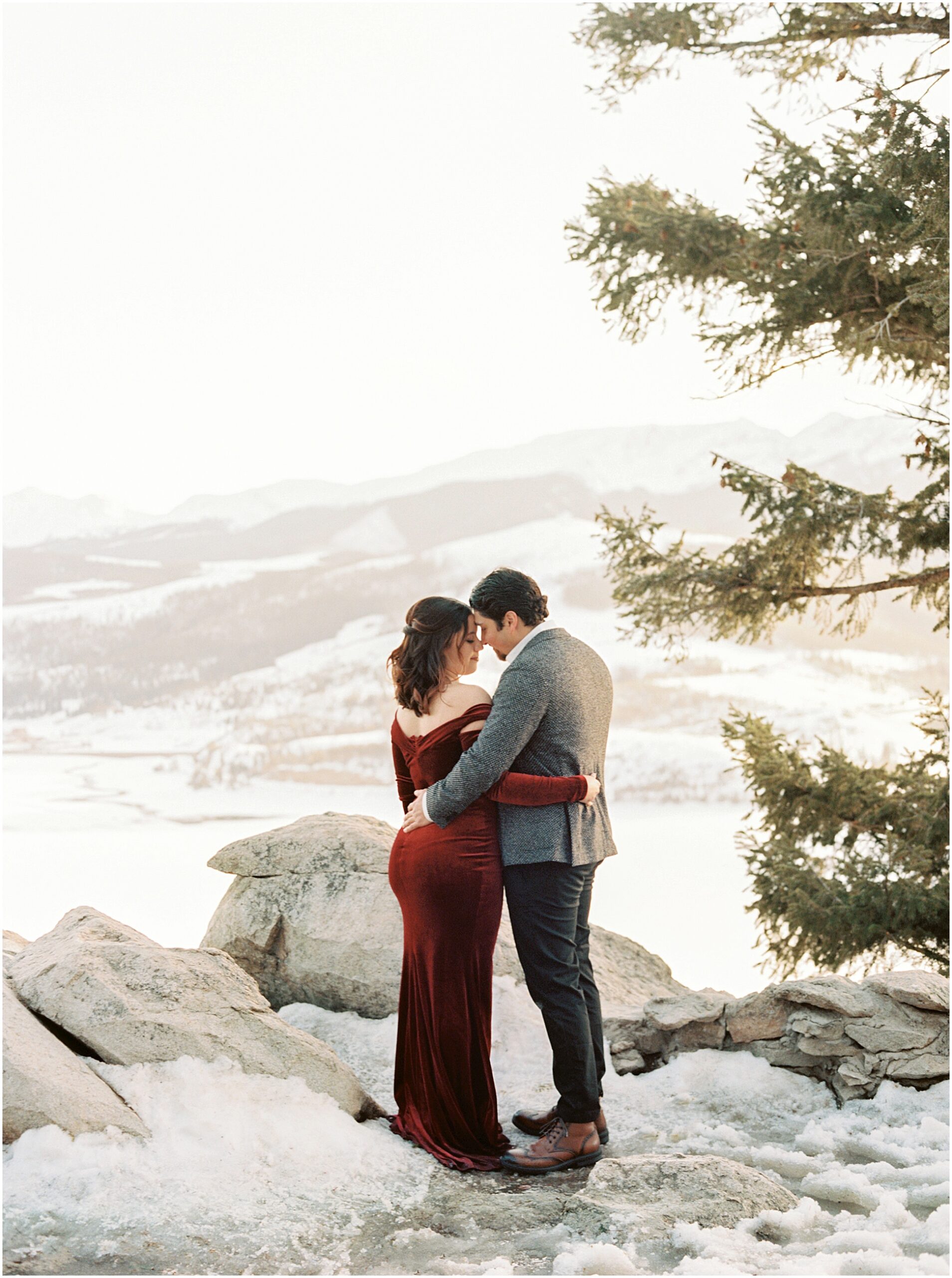 A couple at Sapphire Point, Colorado, overlooking the mountains and Lake Dillon.