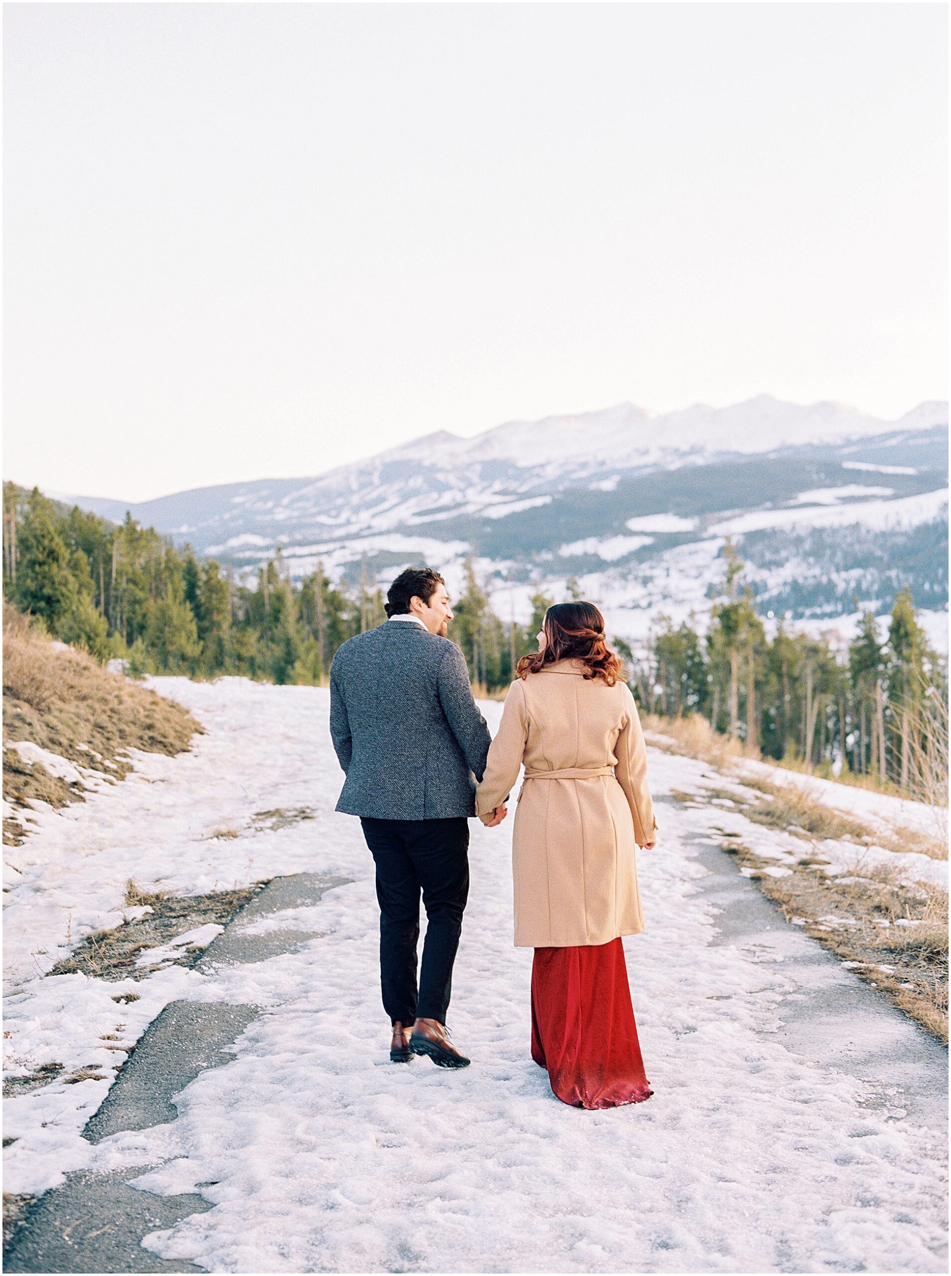 A couple at Sapphire Point, Colorado, overlooking the mountains and Lake Dillon
