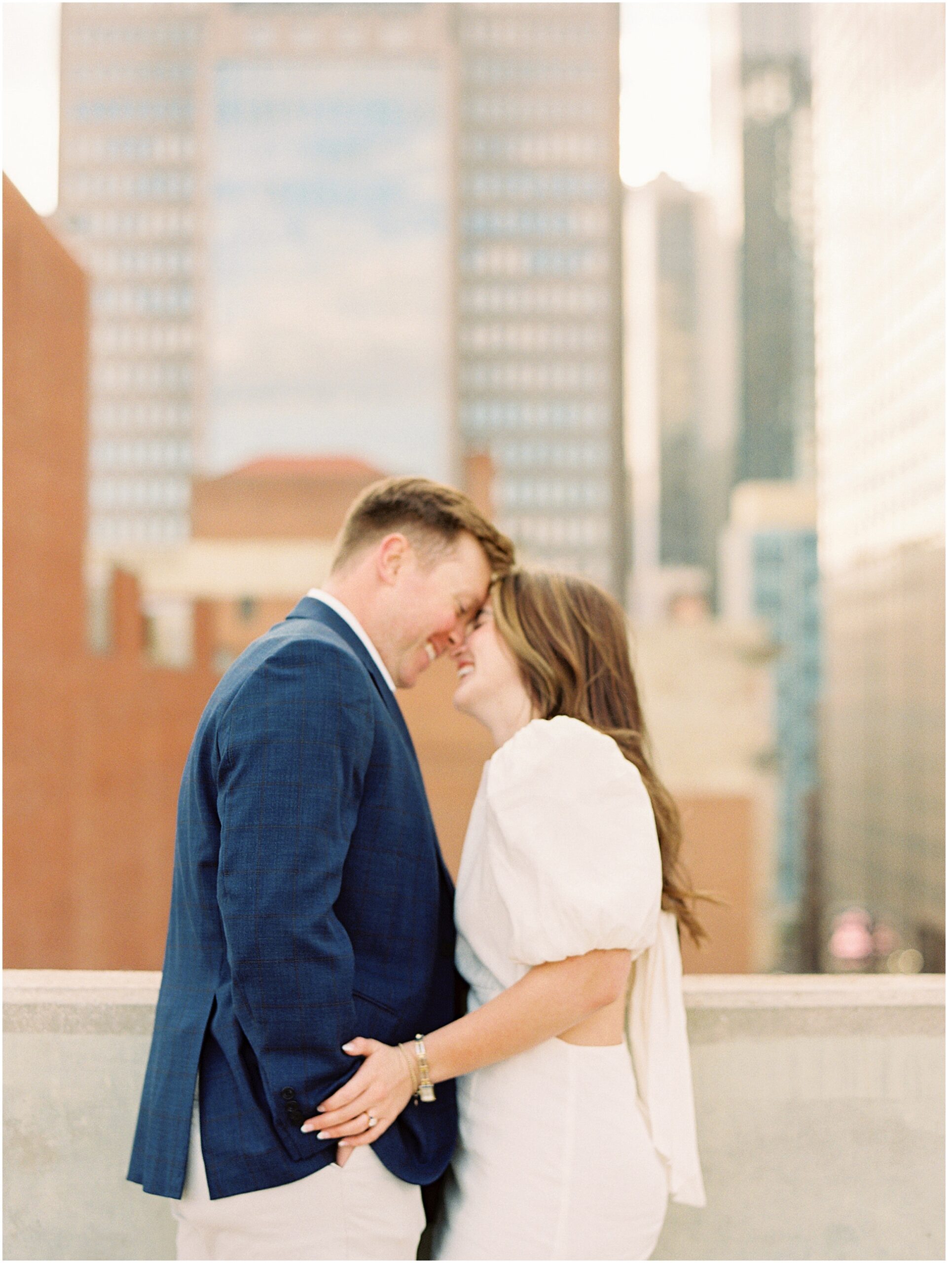 Rooftop Romance: Catherine and Jack Share a Tender Moment with the City Skyline
