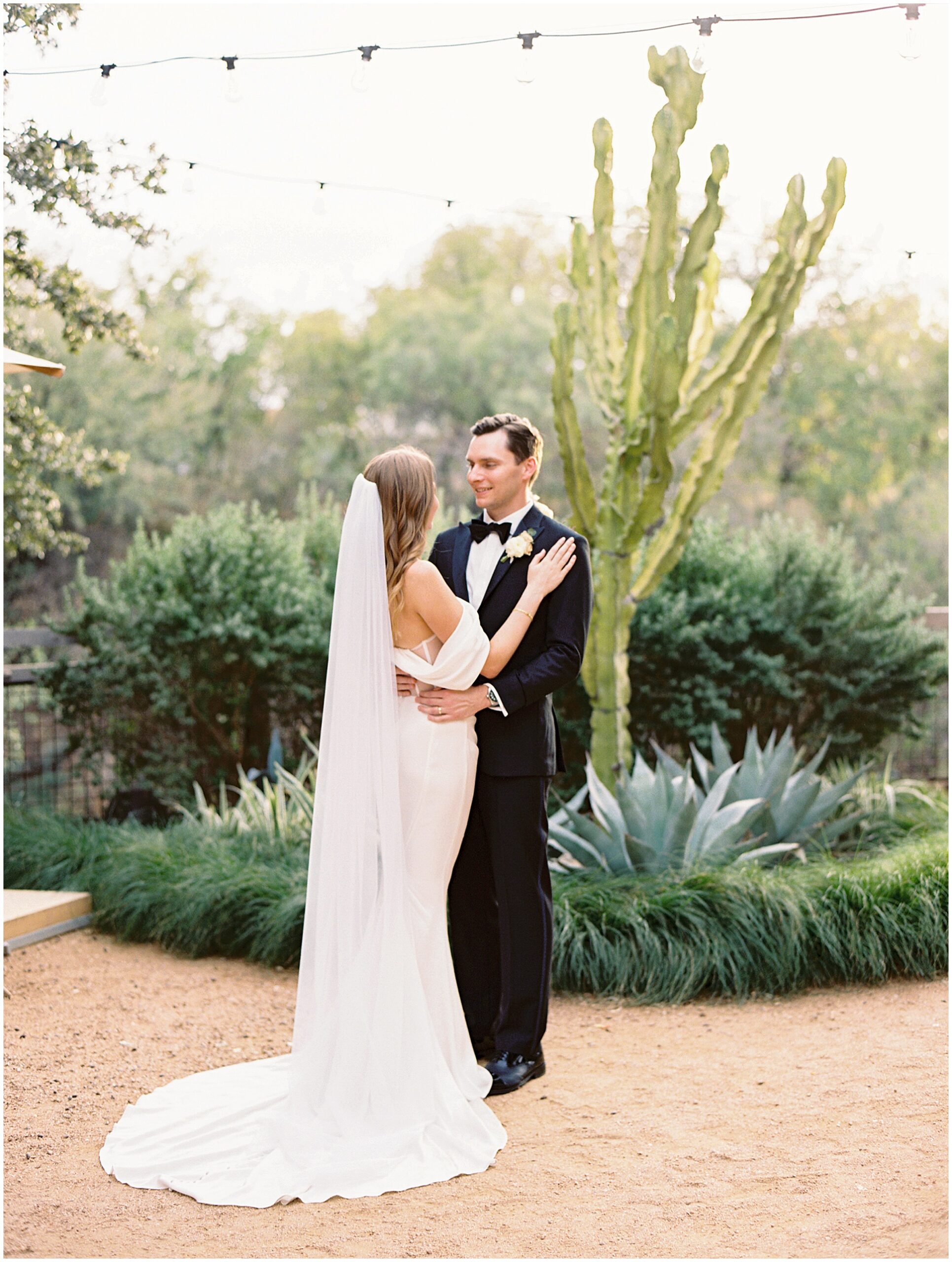 bride and groom embrace at hotel drover